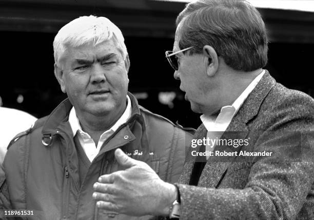 Car owner Junior Johnson, left, talks with NASCAR CEO Bill France Jr. In the Daytona International Speedway garage area prior to the start of the...