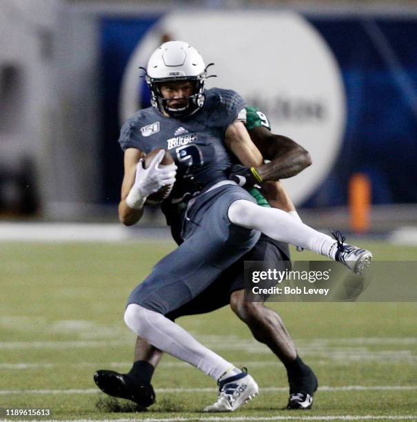 Brad Rozner of the Rice Owls makes a catch in front of Nick Harvey of the North Texas Mean Green for a key first down during the fourth quarter...