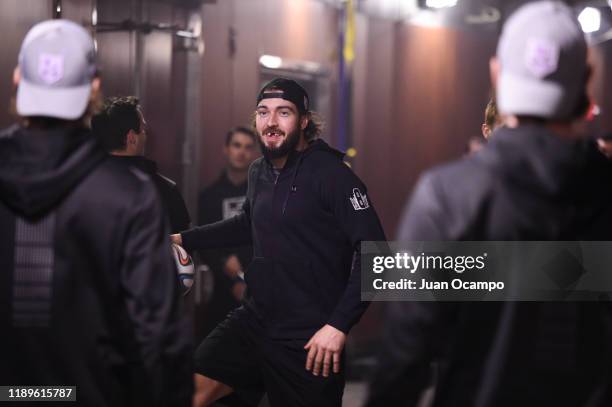 Drew Doughty of the Los Angeles Kings juggles a soccer ball while warming up outside the Kings locker room before the game against the Arizona...