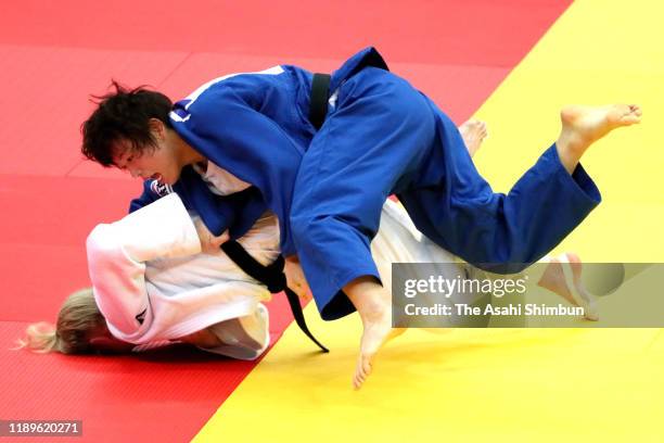 Yoko Ono of Japan and Kim Polling of the Netherlands compete in the Women's -70kg final on day two of the Judo Grand Slam at the Maruzen Intec Arena...