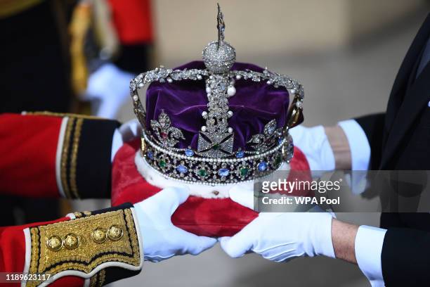 The Imperial State Crown is passed over in the Sovereign's entrance ahead of the state opening of parliament at the Houses of Parliament on December...