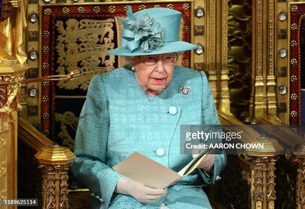 Britain's Queen Elizabeth II reads the Queen's Speech on the The Sovereign's Throne in the House of Lords chamber, during the State Opening of...