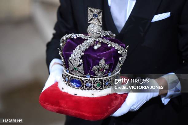 The Imperial State Crown is brought to the Sovereign's Entrance of the House of Lords for the State Opening of Parliament at the Houses of Parliament...