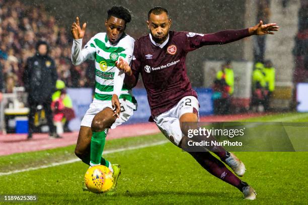 Jeremie Frimpong of Celtic and Loic Damour of Hearts compete for the ball during the Scottish Premier League match between Hearts and Celtic at...