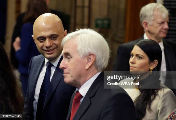 Chancellor Sajid Javid and Shadow Chancelllor John McDonnell and Britain's Home Secretary Priti Patel walk through the Commons Members Lobby to hear...