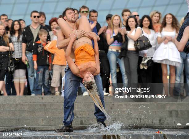 Activists of FEMEN, women's rights organization, perform during their protest action "Ukraine is not brothel " on Independence square in Kiev on May...