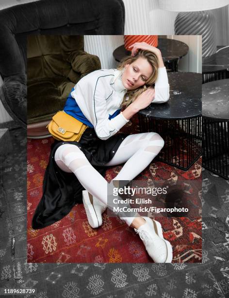 Model Marlijn Hoek is photographed for Madame Figaro on December 14, 2017 in Paris, France. Jacket , leggings , skirt , earrings , bag , shoes ,...