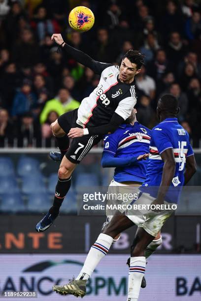 Juventus' Portuguese forward Cristiano Ronaldo jumps to score a header during the Italian Serie A football match Sampdoria vs Juventus on December...
