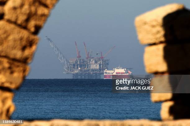 View of the platform of the Leviathan natural gas field in the Mediterranean Sea is pictured from the Israeli northern coastal city of Caesarea on...