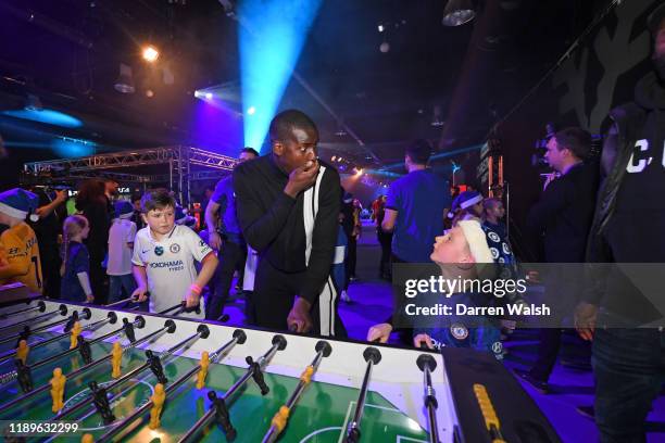 Kurt Zouma of Chelsea playing table soccer during the Junior Blues Christmas Party at Stamford Bridge on December 19, 2019 in London, England.