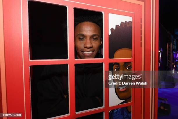 Willian of Chelsea poses in his telephone box during the Junior Blues Christmas Party at Stamford Bridge on December 19, 2019 in London, England.