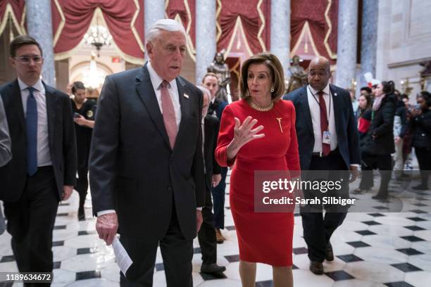 House Majority Leader Rep. Steny Hoyer and House Speaker Nancy Pelosi walk from the House floor where members debate the United States-Mexico-Canada...