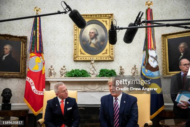 Representative Jeff Van Drew of New Jersey, who has announced he is switching from the Democratic to Republican Party, looks on as U.S. President...