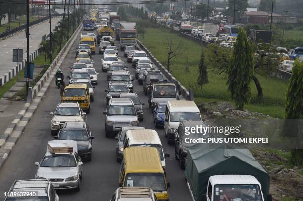 Traffic gridlocks as people shop for gifts ahead of Chritsmas festival in Lagos, on December 17, 2019. - As Christmas festival and holidays draws...