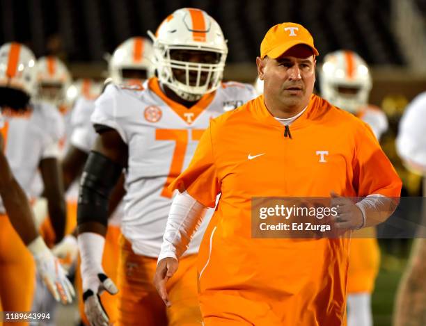 Head coach Jeremy Pruitt of the Tennessee Volunteers leads his team to to the field prior to a game against the Missouri Tigers at Faurot...