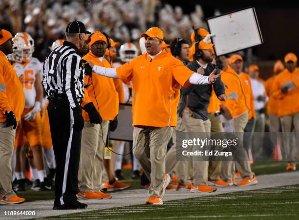 Head coach Jeremy Pruitt of the Tennessee Volunteers talks to an official during a game against the Missouri Tigers in the second quarter at Faurot...