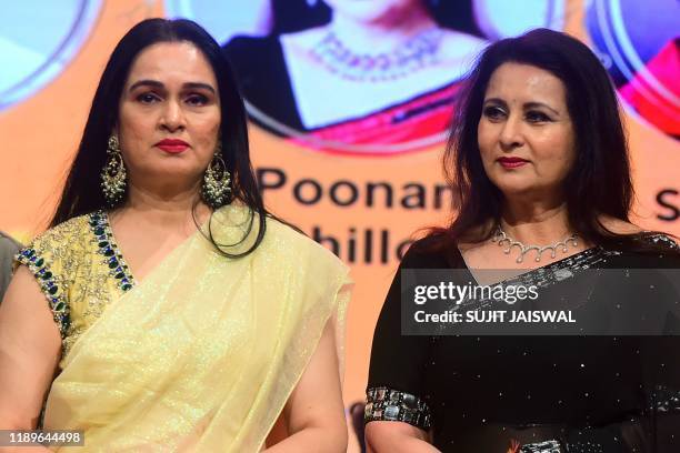 In this picture taken on December 19, 2019 Bollywood actress Padmini Kolhapure and Poonam Dhillon attend a concert to celebrate Bollywood actor...