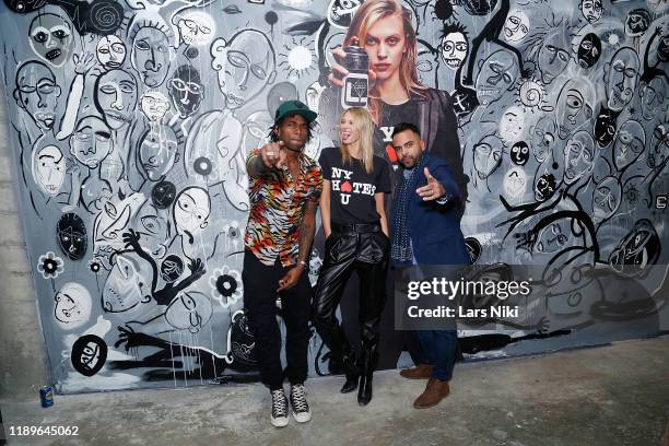 Cavier Coleman, Juliana Schurig and Edward Costa attend the private opening of the Good Luck Dry Cleaners Bowery location at 3 East 3rd on December...