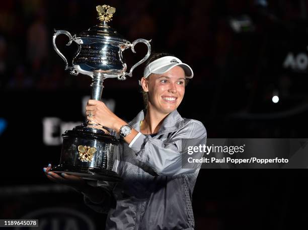 Caroline Wozniacki of Denmark poses with the Daphne Akhurst Trophy after winning the Women's Singles Final against Simona Halep of Romania on day...