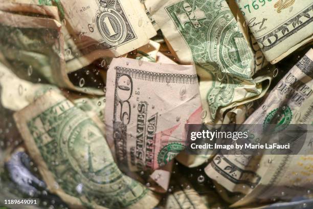 close-up of crumpled money in a glass jar - nota de cinco dólares americanos - fotografias e filmes do acervo