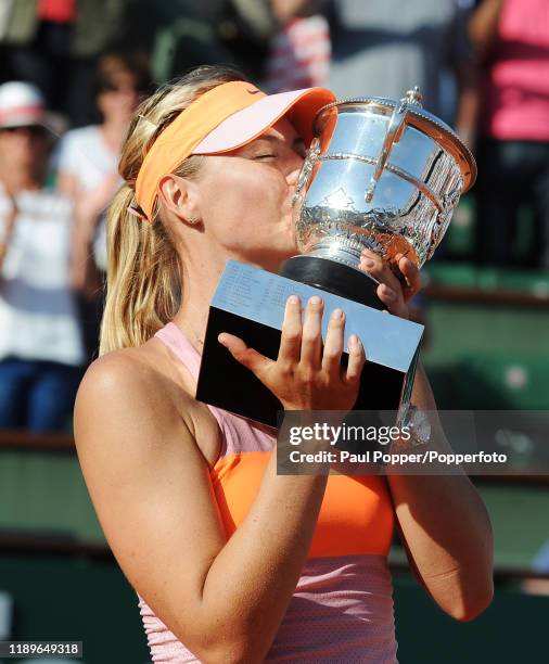 Maria Sharapova of Russia poses with the Coupe Suzanne Lenglen trophy following her victory in her women's singles final match against Simona Halep...