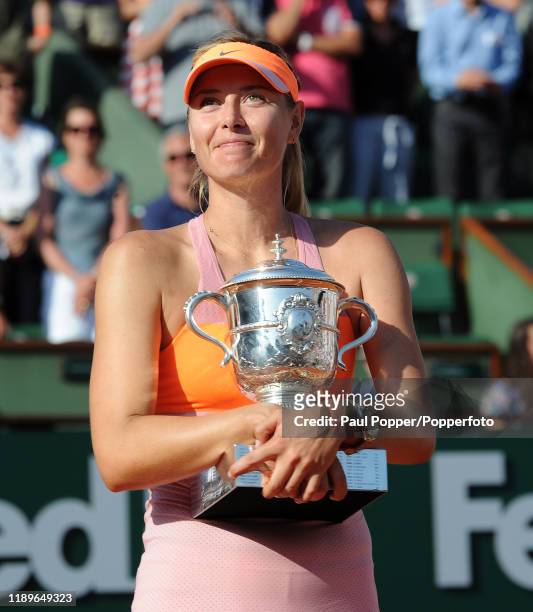 Maria Sharapova of Russia poses with the Coupe Suzanne Lenglen trophy following her victory in her women's singles final match against Simona Halep...