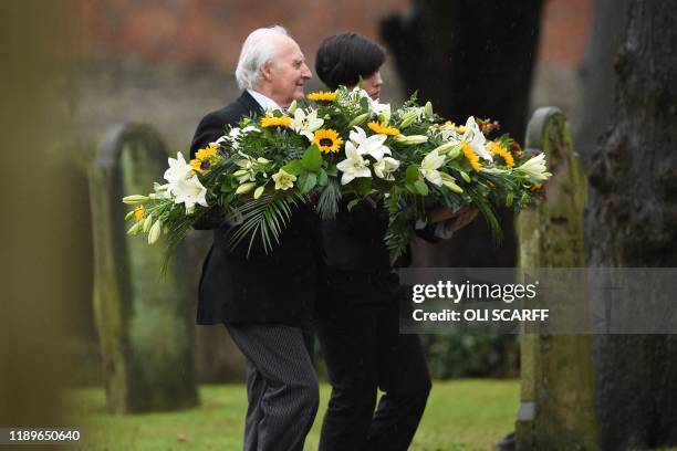 Flowers are taken to the church as family and friends of the victim of the terror attack in Fishmongers' Hall on London Bridge, University of...