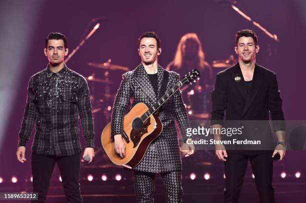 Joe Jonas, Kevin Jonas, and Nick Jonas of The Jonas Brothers perform at Barclays Center on November 23, 2019 in New York City.