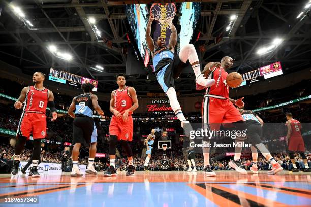 Tristan Thompson of the Cleveland Cavaliers reacts after dunking over Anthony Tolliver of the Portland Trail Blazers during the first half at Rocket...