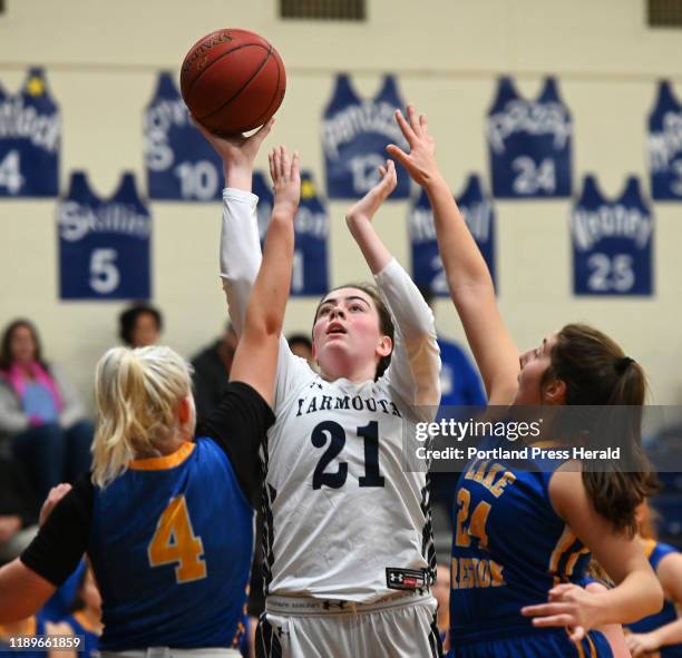 Yarmouth's Margaret McNeil shoots over Lake Region defenders Shelby-Lynne Sheldrick, left and Elle Hall Saturday, Dec. 14, 2019.