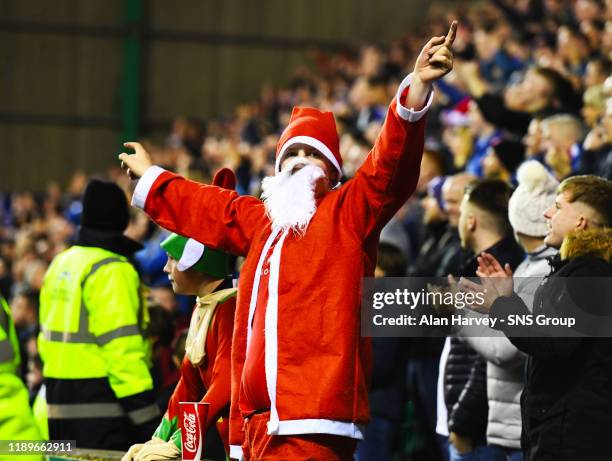 Rangers fans celebrate during a Ladbrokes Premiership match between Hibernian and Rangers, at Easter Road, on December 20 in Edinburgh, Scotland.