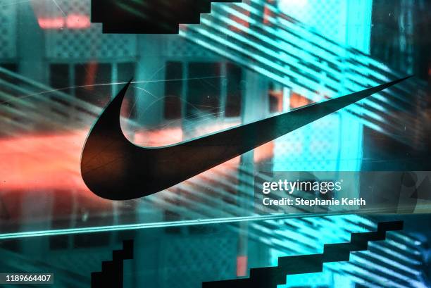 Nike logo is seen at the Nike flagship store on 5th Ave. On December 20, 2019 in New York City. Revenue in the North American market, which accounts...