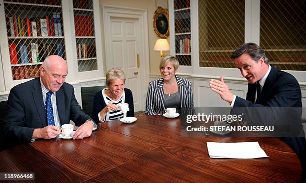 British Prime Minister David Cameron meets with the family of murdered British school girl Milly Dowler father Bob, mother Sally and sister Gemma, at...