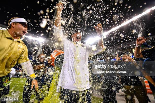 Head coach Butch Davis of the FIU Golden Panthers gets a Gatorade shower after the victory over the Miami Hurricanes at Marlins Park on November 23,...