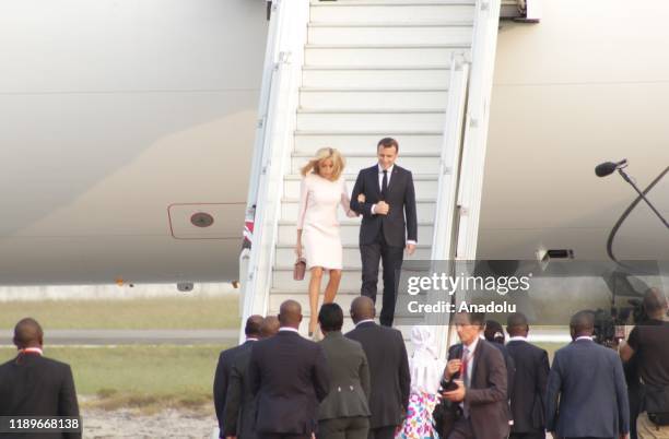 French President Emmanuel Macron and his wife Brigitte Macron are being welcomed by President of Ivory Coast Alassane Ouattara and his wife Dominique...