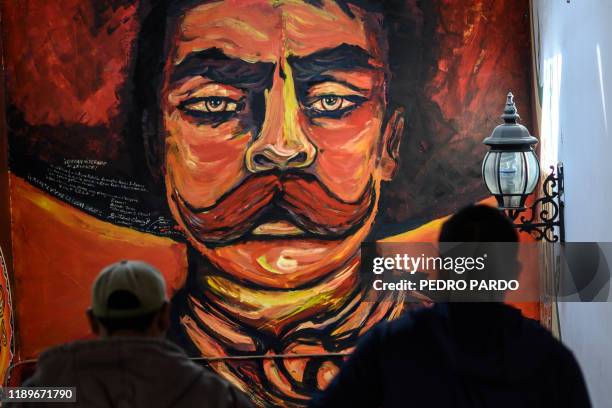 Mural of the Mexican revolutionary hero Emiliano Zapata is seen at the "Greater Council" in Cheran, Michoacan state, Mexico, on December 10, 2019. -...