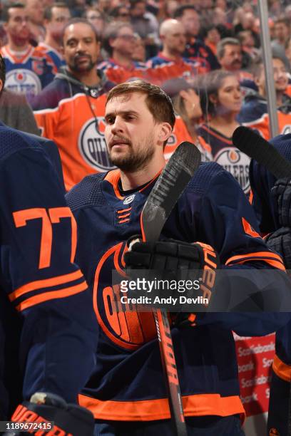 Kris Russell of the Edmonton Oilers stands for the singing of the national anthem prior to the game against the Pittsburgh Penguins on December 20 at...