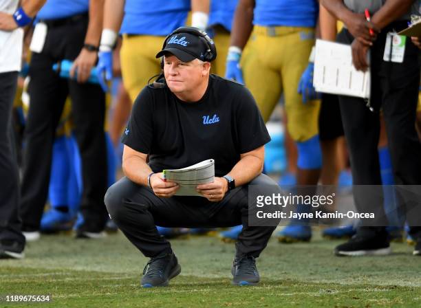 Head coach Chip Kelly of the UCLA Bruins looks on during the game against the USC Trojans at the Los Angeles Memorial Coliseum on November 23, 2019...