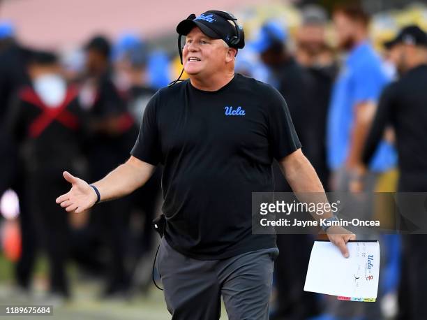 Head coach Chip Kelly of the UCLA Bruins pleads his case with officials during the game against the USC Trojans at the Los Angeles Memorial Coliseum...