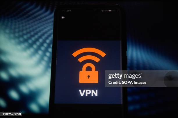 In this photo illustration a VPN logo seen displayed on a smartphone.