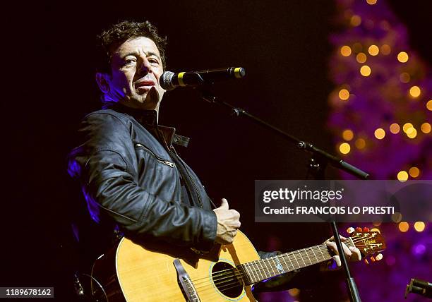 French singer Patrick Bruel performs on stage on December 20, 2019 at the Cite des Congres in valenciennes, northern France, during a concert...