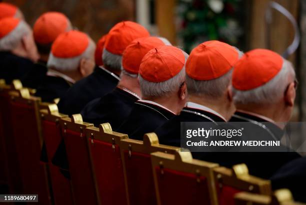Cardinals listen as the Pope delivers a speech on the occasion of his Christmas greetings to the Roman Curia, in the Clementine Hall at the Vatican...