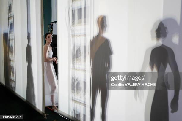 Dancer of the Monte-Carlo ballet looks on during the rehearsal of the ballet show "Coppel-i.A" a creation by French dancer and choreographer...