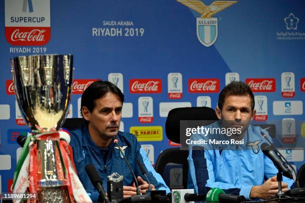 Lazio head coach Simone Inzaghi and Senad Lulic of SS lazio attend during the a press conference before Sunday's Italian Supercup match against...