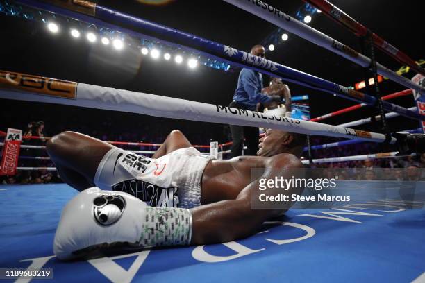Referee Kenny Bayless sends WBC heavyweight champion Deontay Wilder to a neutral corner after he knocks out Luis Ortiz in the seventh round of their...