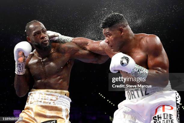 Heavyweight champion Deontay Wilder trades punches with Luis Ortiz during their title fight at MGM Grand Garden Arena on November 23, 2019 in Las...