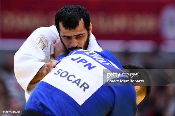 Elmar Gasimov of Azerbaijan and Aaron Wolf of Japan compete in the Men's -100kg semifinal on day three of the Judo Grand Slam at the Maruzen Intec...