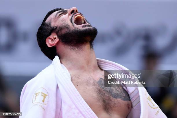 Elmar Gasimov of Azerbaijan celebrates after defeating Aaron Wolf of Japan in the Men's -100kg semifinal on day three of the Judo Grand Slam at the...