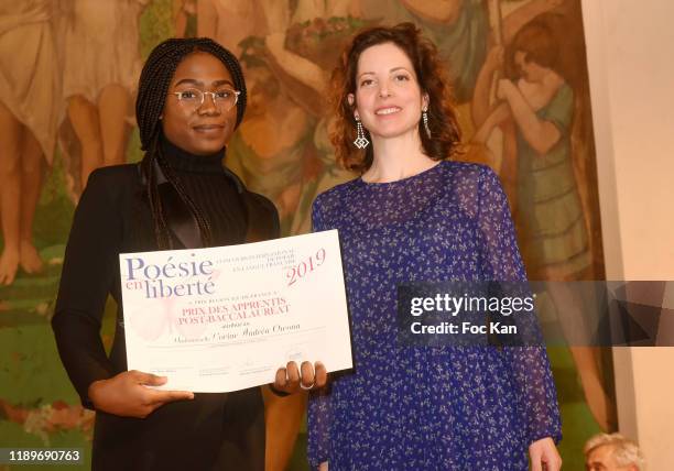 Maia Brami awards Corine Andrea Owona during "Poesie En Liberté": 2019 Awards Ceremony At Mairie Du 5eme on November 23, 2019 in Paris, France.