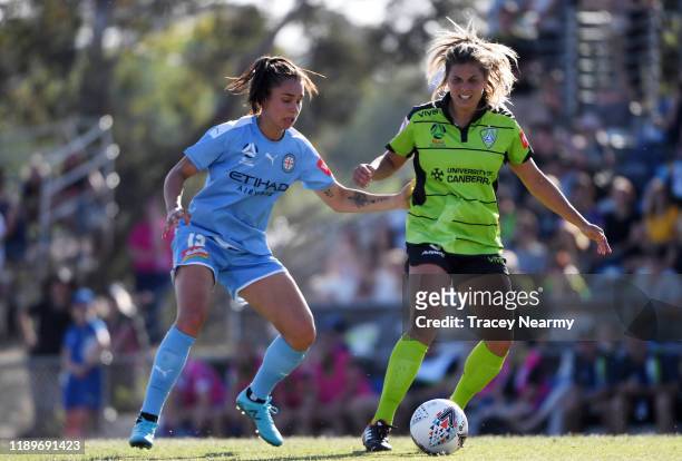 Emma Checker of Melbourne City FC tackles Katherine Stengel of Canberra United during the round 2 W-League match between Canberra United and...
